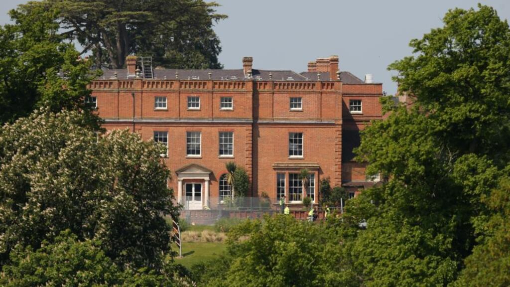A security fence surrounds The Grove hotel which is hosting the annual Bilderberg conference in Watford, England.  Photograph:  Oli Scarff/Getty Images