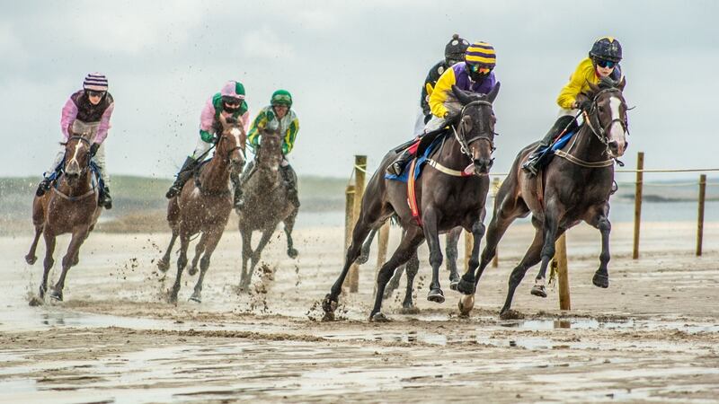 Shifting on sand: Action from the Omey Island Races in County Galway. Photograph: Martin Kalvaster