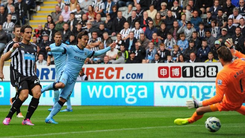 David Silva of Manchester City scores the opening goal against  Newcastle United. Photograph:  Stu Forster/Getty Images