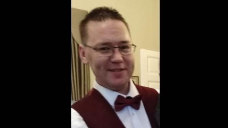 Garreth Kelly (39)  had parked his car in the Kingswood estate and was trying to start it on Tuesday morning, using jump leads, when he was stabbed and died at the scene.
