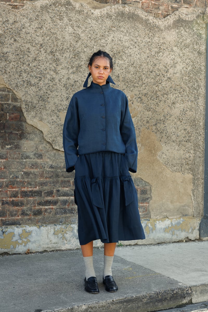 Cropped jacket in navy Irish upholstery linen and handmade binding, €450, with tumble-washed linen skirt