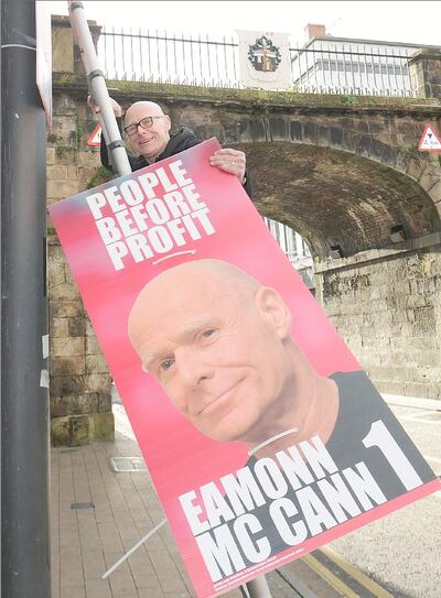 Eamonn McCann, as a People Before Profit candidate in 2016, hanging a poster on Shipquay Street in Derry. Photograph: Trevor McBride