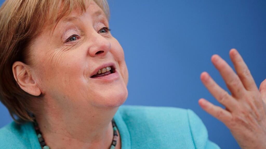German chancellor Angela Merkel: “I am sufficiently equipped with a scientific mind to see that the objective circumstances require that we cannot continue at this pace, but must speed up.”  Photograph:  Hannibal Hanschke