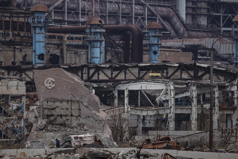 A destroyed monument with Azovstal logo at the main entrance to the Azovstal steel plant in Mariupol, eastern Ukraine. Some 2,000 Ukrainian fighters from various units gathered in the plant to make a last stand for Mariupol, and hundreds of civilians sought refuge in labyrinthine tunnels and bunkers. Photograph: Sergei Ilnitsky/EPA