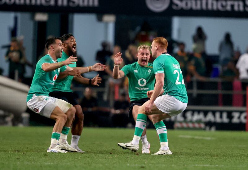 Ireland's Conor Murray, Bundee Aki and Craig Casey celebrate with  Ciarán Frawley after his dramatic match-winning drop goal against South Africa in Durban. Photograph: Dan Sheridan/Inpho  