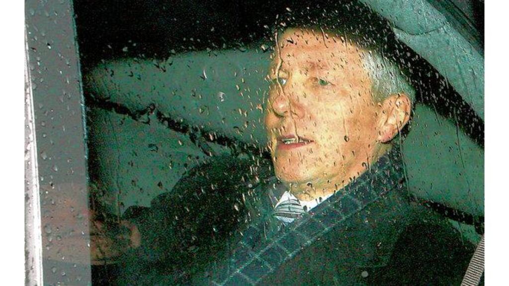 Peter Robinson leaving Parliament Buildings in Stormont yesterday after he stood down temporarily as Northern Ireland's First Minister over disclosures involving his family. Photograph: Peter Morrison/AP