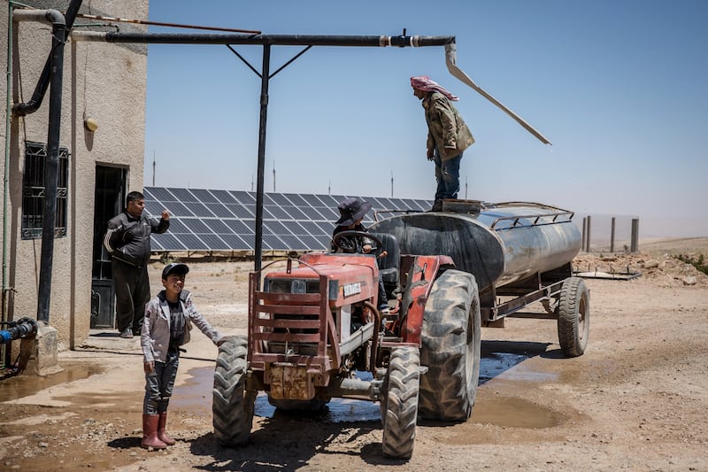 Syrians prepare to irrigate roses in Qaldoun Al Marah. Photograph: Sally Hayden