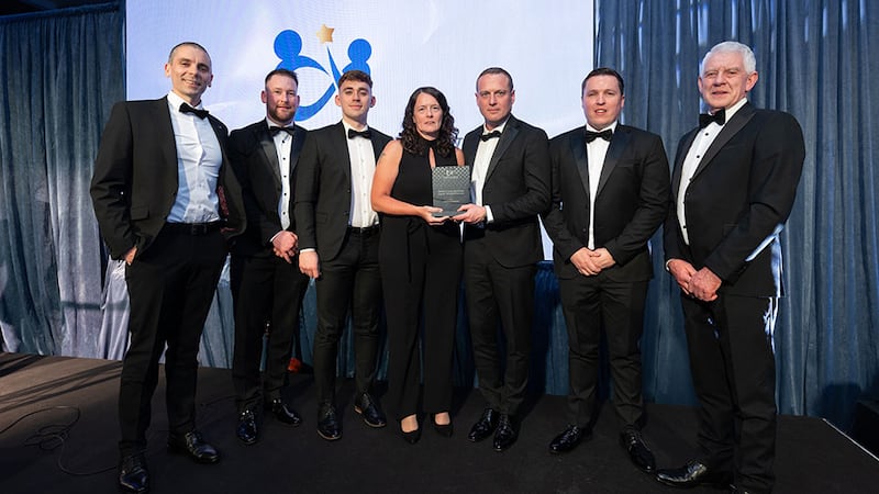 Susan O'Connor, awards judge, presents the health & safety excellence award - utilities & services to Activ8 Solar Energies team