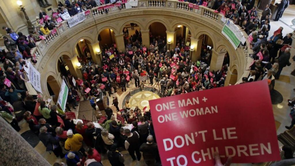 Opponents of a bill to legalise gay marriage in Minnesota gathered in the State Capitol, Rotunda, to voice their opposition. Photograph: AP/Jim Mone