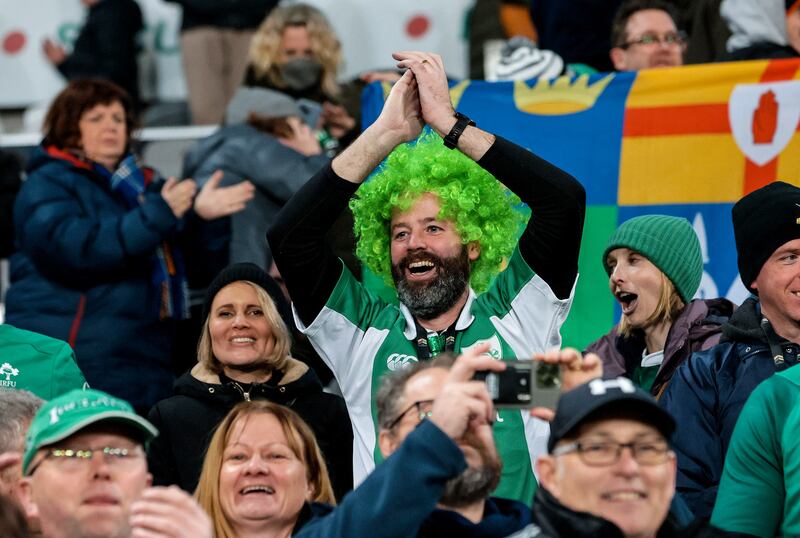 Delighted Ireland fans celebrate the victory over New Zealand at the 
 Forsyth Barr Stadium, Dunedin. Photograph: Billy Stickland/Inpho 
