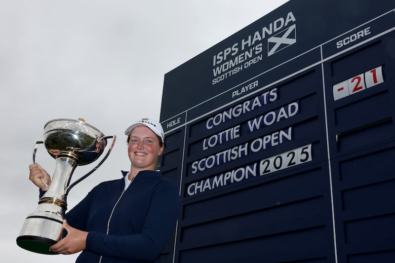 Lottie Woad of England poses with the trophy following victory of the ISPS HANDA Women's Scottish Open. Photograph: Kate McShane/Getty