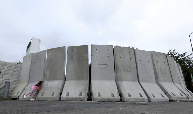 Concrete barriers erected overnight at the scene of the violence at the old Crown Paints factory in Coolock, which has been earmarked for asylum seeker accommodation. Photograph:Colin Keegan/Collins