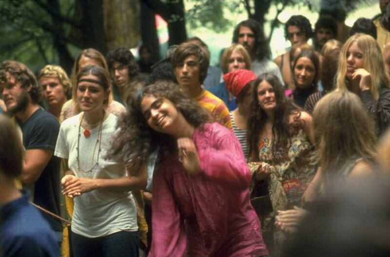 Psylvia, dressed in a pink Indian shirt, dancing in midst of the crowd, during Woodstock. Photograph: Bill Eppridge/The LIFE Picture Collection/Getty