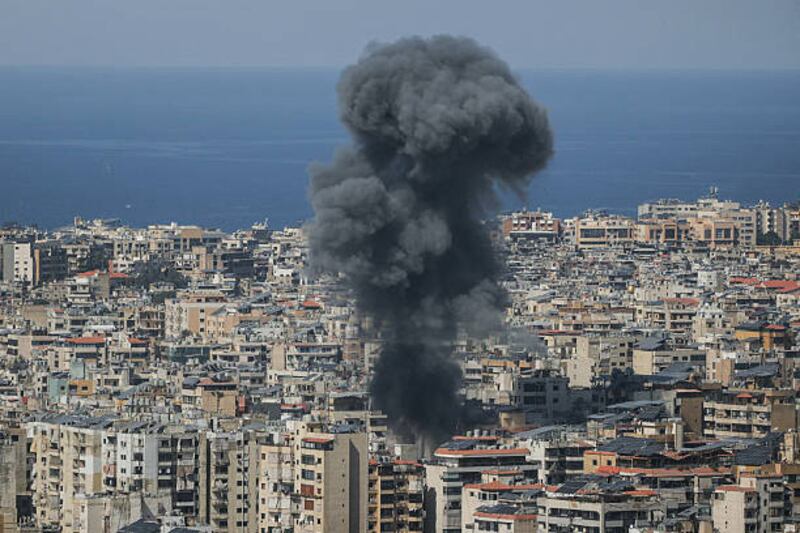 Smoke rises from the site of an Israeli air strike that targeted an area in Beirut's southern suburbs on Wednesday. Photograph: Ibrahim Amro/AFP via Getty Images 