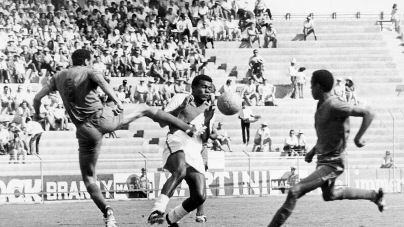 Moroccan defender Khanousi Moulay Idriss challenges Peru’s  Teofilo Cubillas at the 1970 World Cup. Photograph: Getty Images