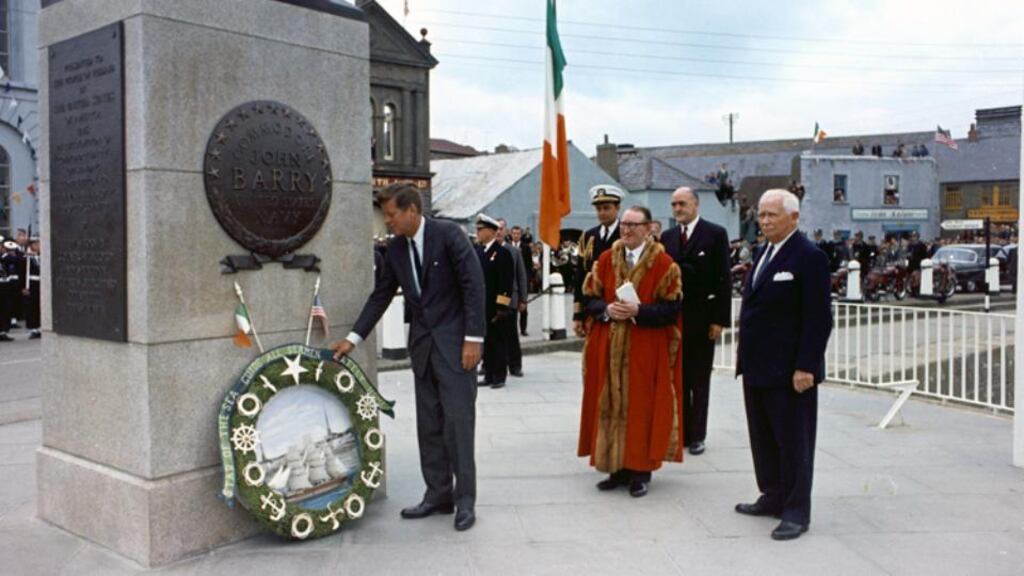 Another naval hero and emigrant son of Wexford, John F Kennedy, laying a wreath at the statue of John Barry at Crescent Quay, Wexford, in 1963. Photograph:  Robert Knudsen/White House