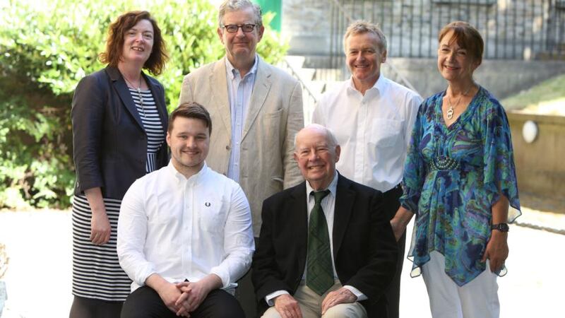 John Patrick McHugh and Gordon Snell, seated, with Margaret Kelleher,  James Ryan, judge Niall MacMonagle and Éilís Ní Dhuibhne at the presentation of the Maeve Binchy Travel Award. Photograph: Jason Clarke