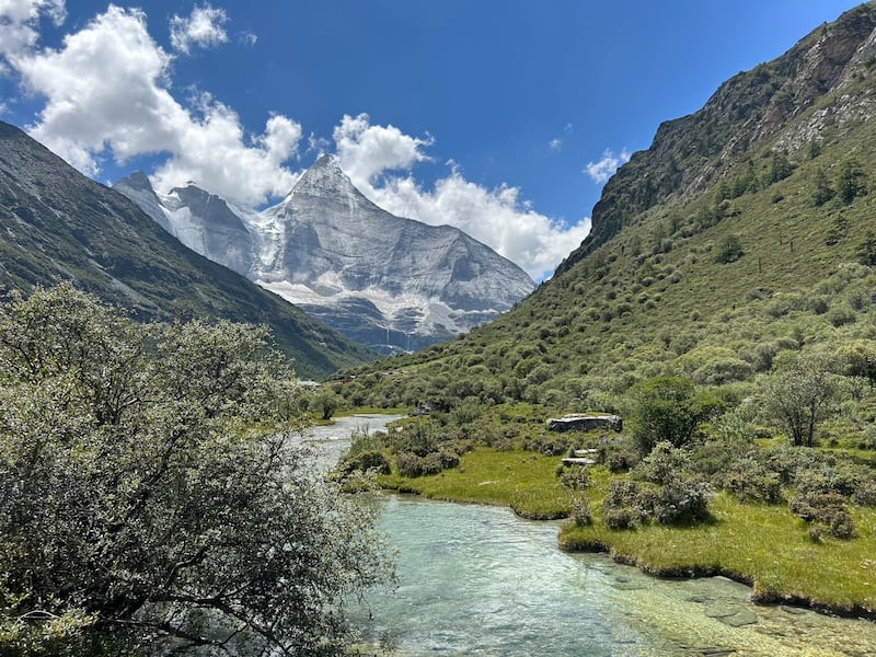 The lush Yading valley, which lies below three holy, snow-capped mountains with hanging glaciers, dense forests and shimmering lakes and streams, is said to have inspired James Hilton's novel Last Horizon. Photograph: Denis Staunton