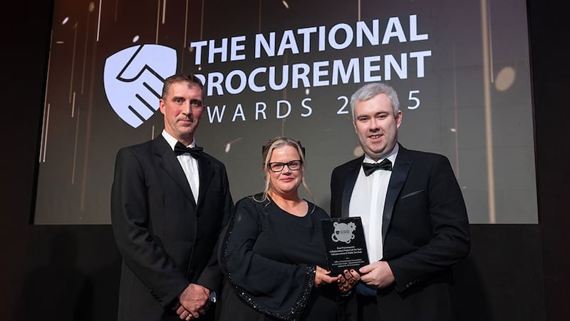 Fran Kehoe, awards judge, presents the best procurement collaboration project of the year - infrastructure & public services award to Emily Egan & Jason Connery, Office of Government Procurement & Irish Coast Guard.