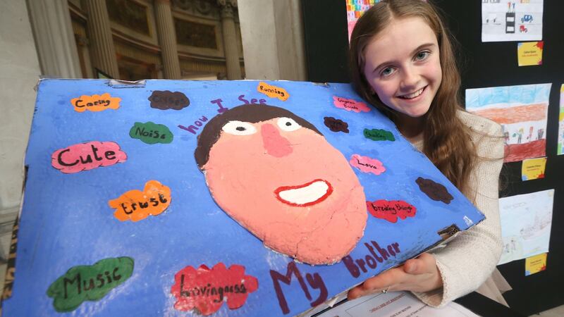 Maeve Allen from Ballinderry NS, Co Galway with artwork dedicated to  her brother Liam, was a finalist in the ‘Someone Like Me’ national art competition. Photograph: Finbarr O’Rourke