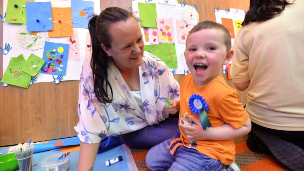 Marion Dennis with her son Jamie  (3) at the Preparing for Life programme managed by the Northside Partnership.   Photograph: Alan Betson