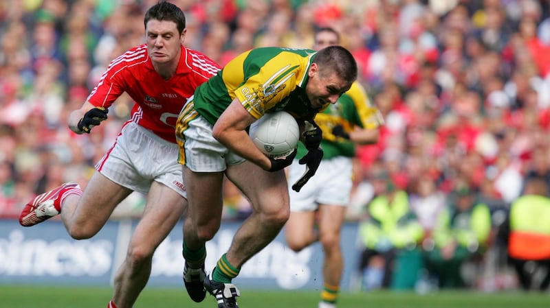 Kerry’s Darragh Ó Sé  seizes the ball with Cork’s Michael Cussen in hot pursuit during the All-Ireland football final at Croke Park on September 16th, 2007. Photograph: Kate Geraghty
