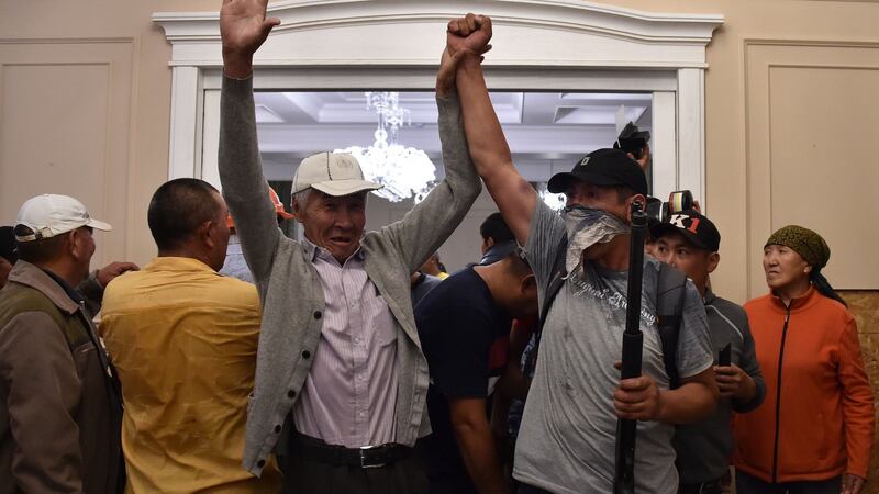 Supporters of former Kyrgyz president Almazbek Atambayev guarding his house during a  raid by special forces on Wednesday. Photograph:  Vyacheslav Oseledko/AFP/Getty Images