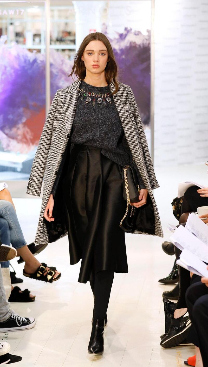 no fee if Arnotts mentioned in caption at the Arnotts Autumn Winter 2017 Womenswear Show-photo Kieran HarnettNiamh Houndstooth coat, SET, €400Grey jewelled wool knit, Tara Jarmon, €270Black taffeta skirt, Caroline Kilkenny, €256Black and gold bag Ralph Lauren, €225Boots by Nine West