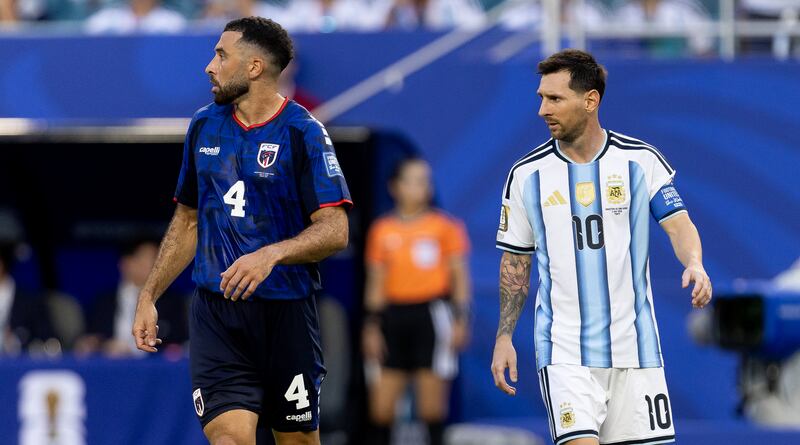 Roberto Lopes with Lionel Messi of Argentina. Photograph: Enzo Santos Barreiro/INPHO