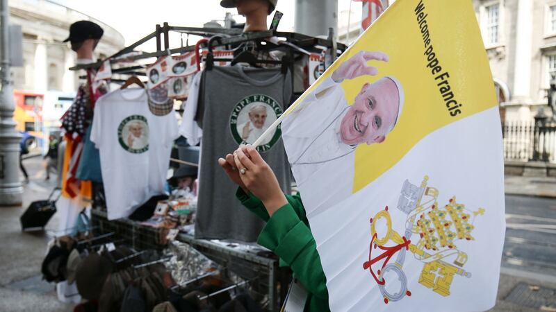 T-Shirts and flags of Pope Francis on sale in Dublin, ahead of this weekend’s visit  by Pope Francis. Photograph: Aaron Chown/PA Wire