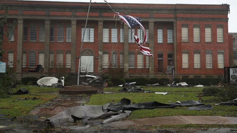 An American flag flies from a broken flagpole after Hurricane Michael passes through Panama City, Florida, US. Photograph: Joe Raedle/Getty Images