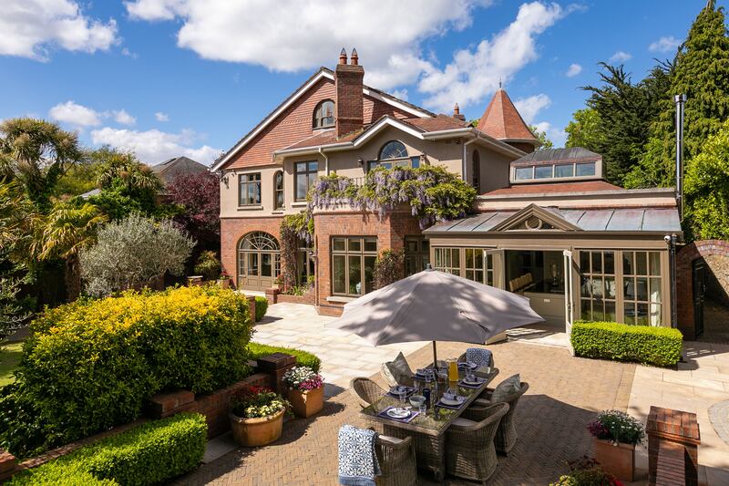 The kitchen opens out to a patio in the rear garden