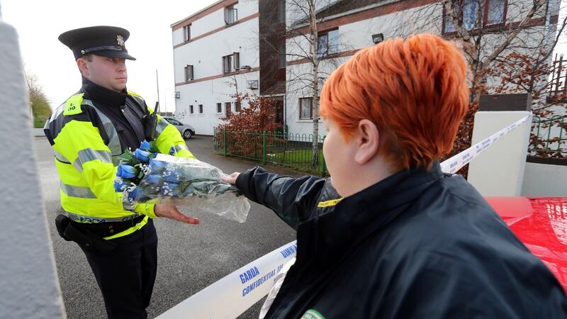 Flowers are left at the scene of an apartment fire in Dublin that claimed the lives of a woman and three children. Photograph: Niall Carson/PA Wire