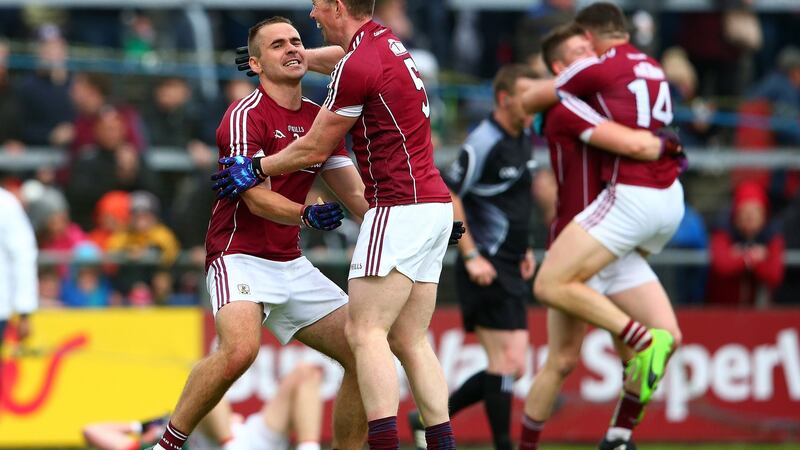 Galway’s Cathal Sweeney and Gareth Bradshaw celebrate victory over Mayo after the final whistle. Photograph: Cathal Noonan/Inpho