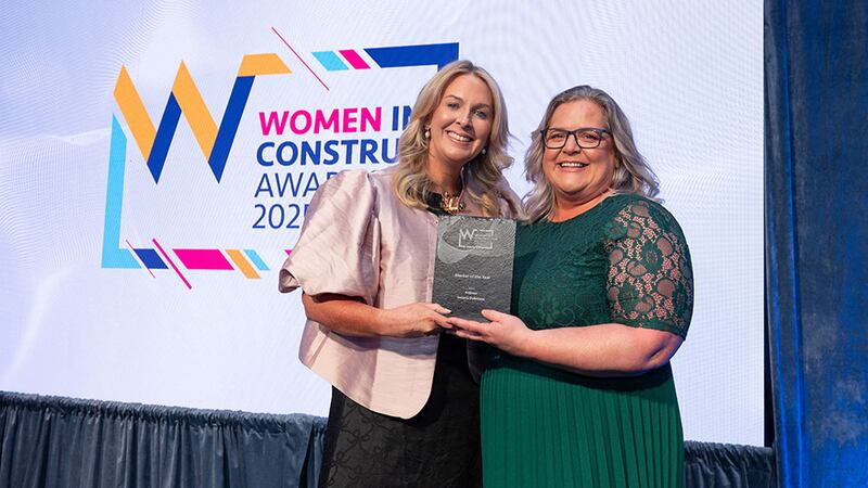 Emma Maye, awards judge, presents the mentor of the year award to Bridgin Grant-Osgood on behalf of Suzana Dobrescu, Ardmac