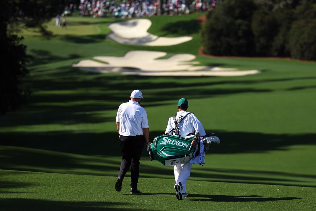 Ireland's Shane Lowry with caddie Darren Reynolds on the 10th hole during a practice round prior to the 2024 Masters at Augusta National golf club in Georgia. Photograph: Andrew Redington/Getty Images