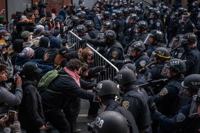 Protesters confront police near a US Immigration and Customs Enforcement facility in San Francisco. Photograph: Loren Elliott/The New York Times