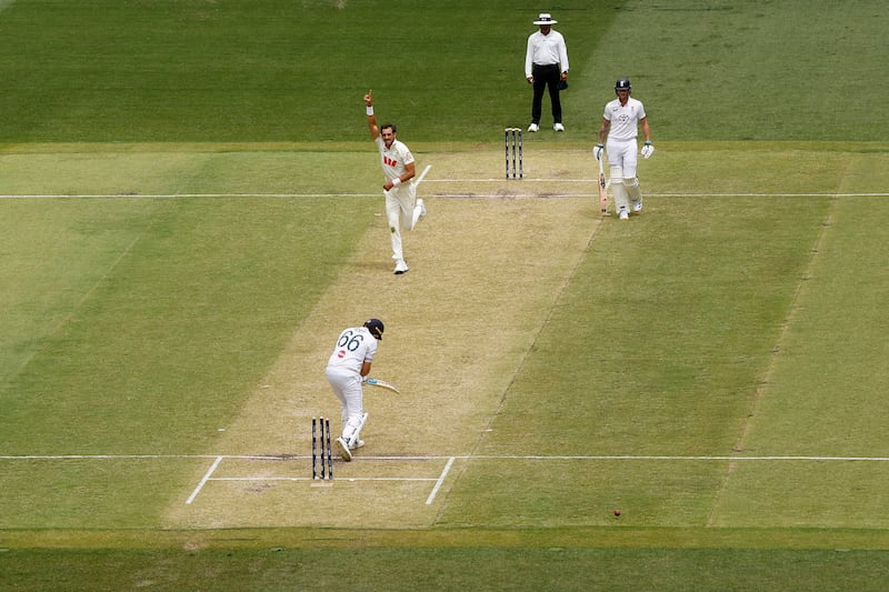 Mitchell Starc of Australia celebrates the wicket of Joe Root. Photograph: Darrian Traynor/Getty