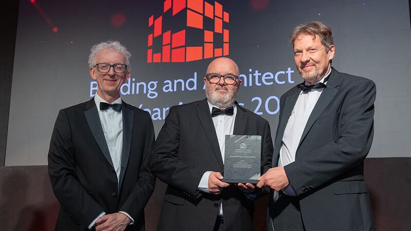 Patrick Flynn, awards judge, presents the building of the year - medical & health to Victor Lowe, OCMA, and Kevin Jackson, KJA