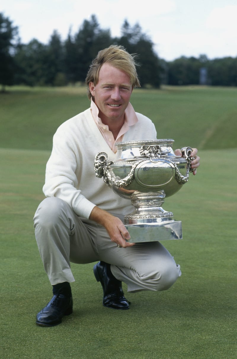 PARIS - JULY 1: Philip Walton of Ireland lifts up the trophy after winning the Peugeot French Open held on July 1, 1990 at the Chantilly G.C. in Paris, France. (Photo by Stephen Munday/Getty Images)