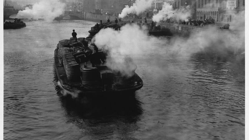 A barge transporting goods on the River Liffey. Photograph:  Â© Hulton-Deutsch Collection/Corbis via Getty Images