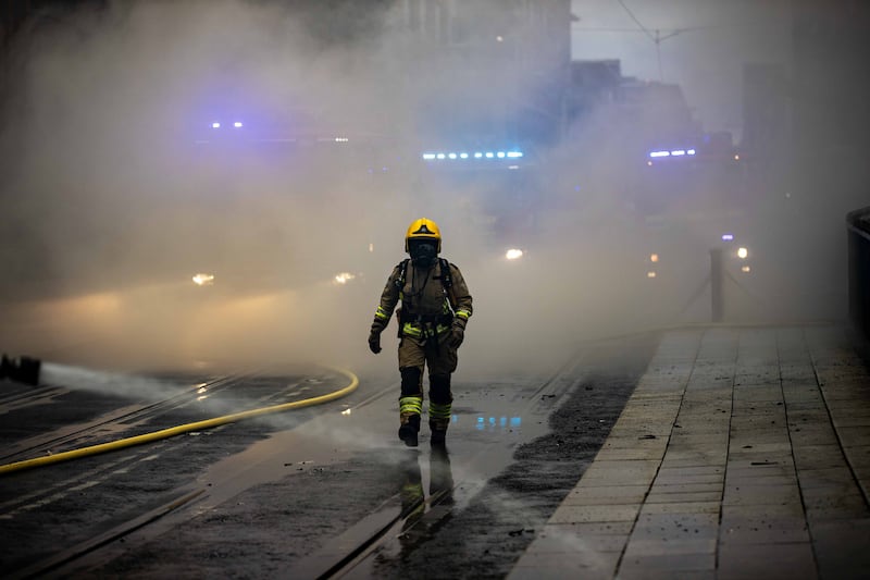 Dublin Fire brigade members battle a fire in the IFSC complex on Tuesday night. Photograph: Damien Storan