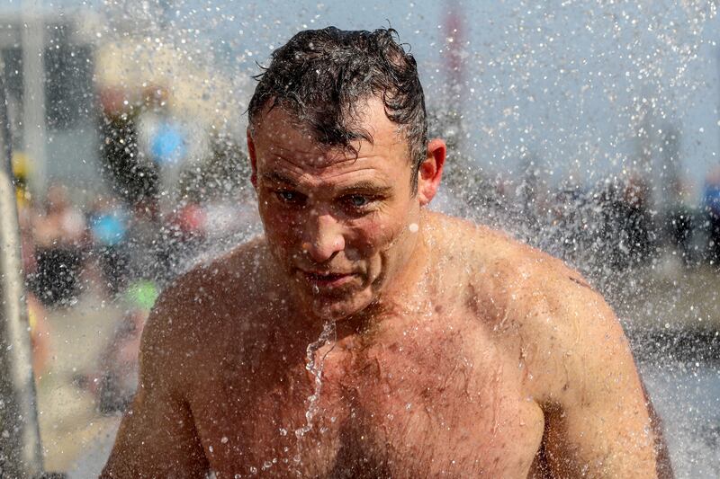 Men’s winner Paul Mulvehill showers after the race. Photograph: Ben Brady/Inpho