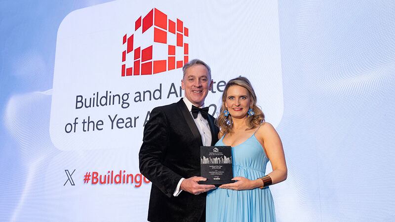 Barry Hennessy, director, business development & marketing, presents the building of the year - office (small) award to Ami Black, Little Black Box Collective