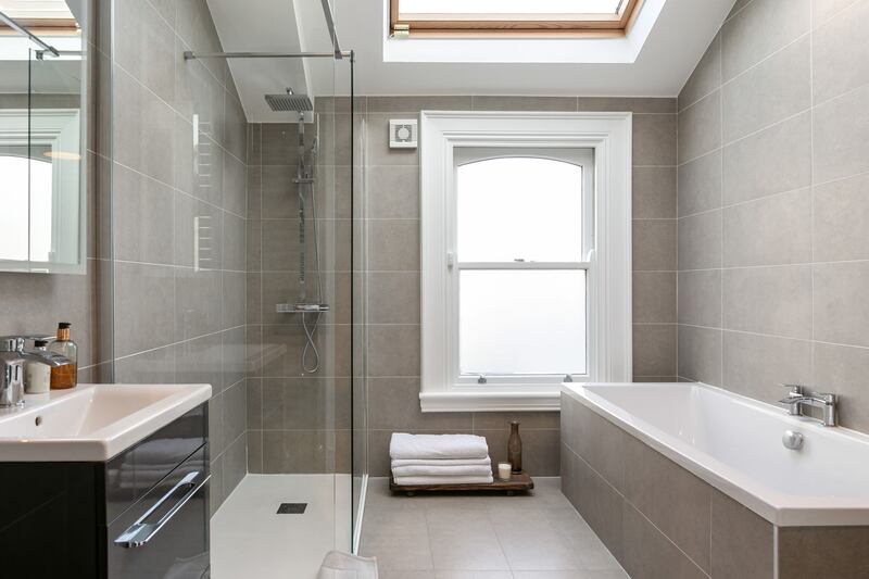The main bathroom has been completely renovated and features a shower, a bath and a Velux window.