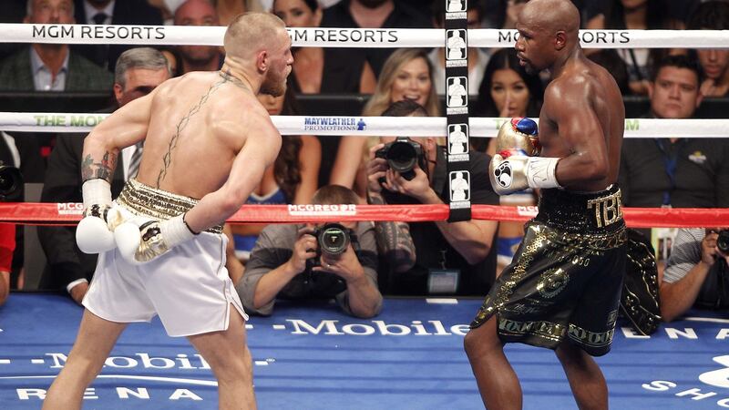 Conor McGregor in action against Floyd Mayweather. Photograph:  Derek Hogan/Inpho