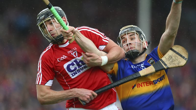 Cork’s Killian Burke clashes with Tipperary’s John McGrath at Semple Stadium. Photograph: Inpho/Ken Sutton