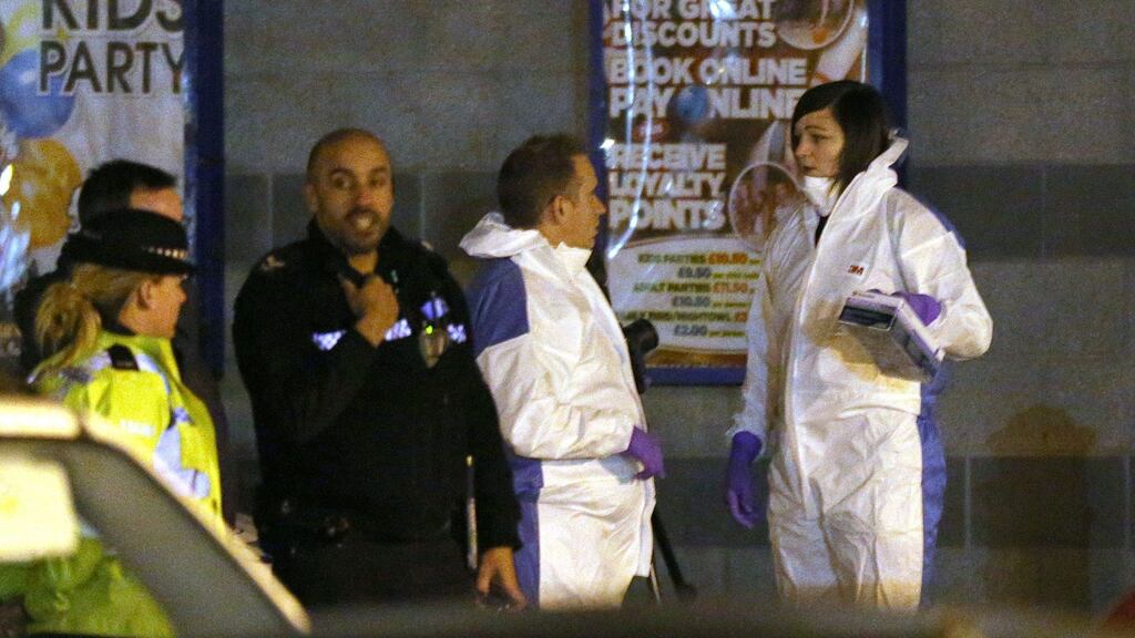 Police at Bermuda Park in Nuneaton, Warwickshire, where a gunman held two bowling alley staff hostage for over four hours. Photograph: Aaron Chown/PA