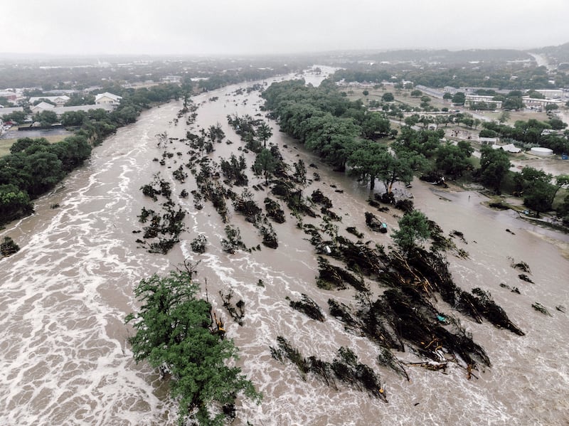 The flooded Guadalupe river in Kerrville, Texas. Photograph: Carter Johnston/The New York Times
                      