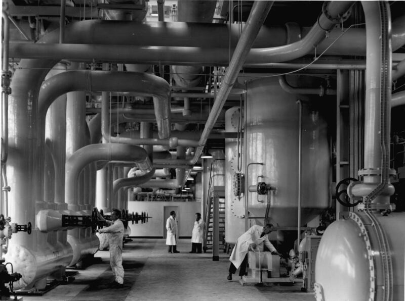 Scientists and technicians work amid cooling systems and pipework in  Calder Hall at Sellafield, Cumbria, England, in 1956. Photograph: US Department of Energy/Smith Collection/Gado/Getty 